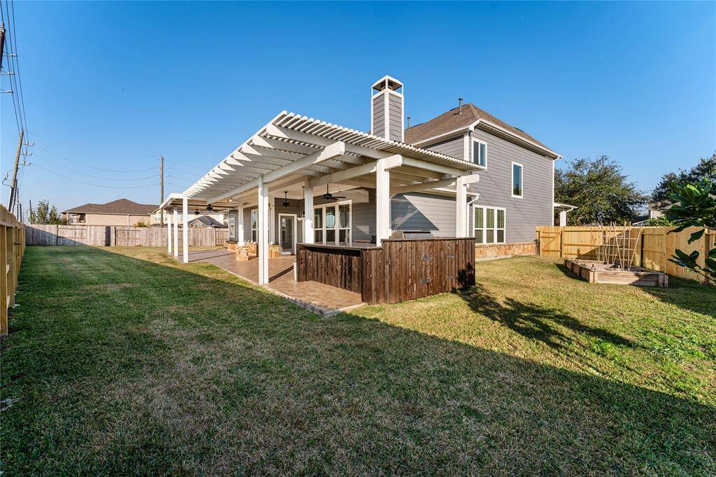 Summertime will be much sweeter with a large fully fenced-in backyard! Frolic, play, and garden in the backyard and bask in the privacy!