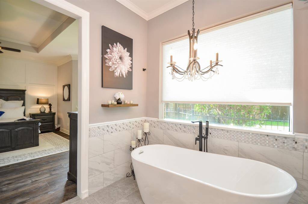 Spa-like freestanding tub with gorgeous chandelier!