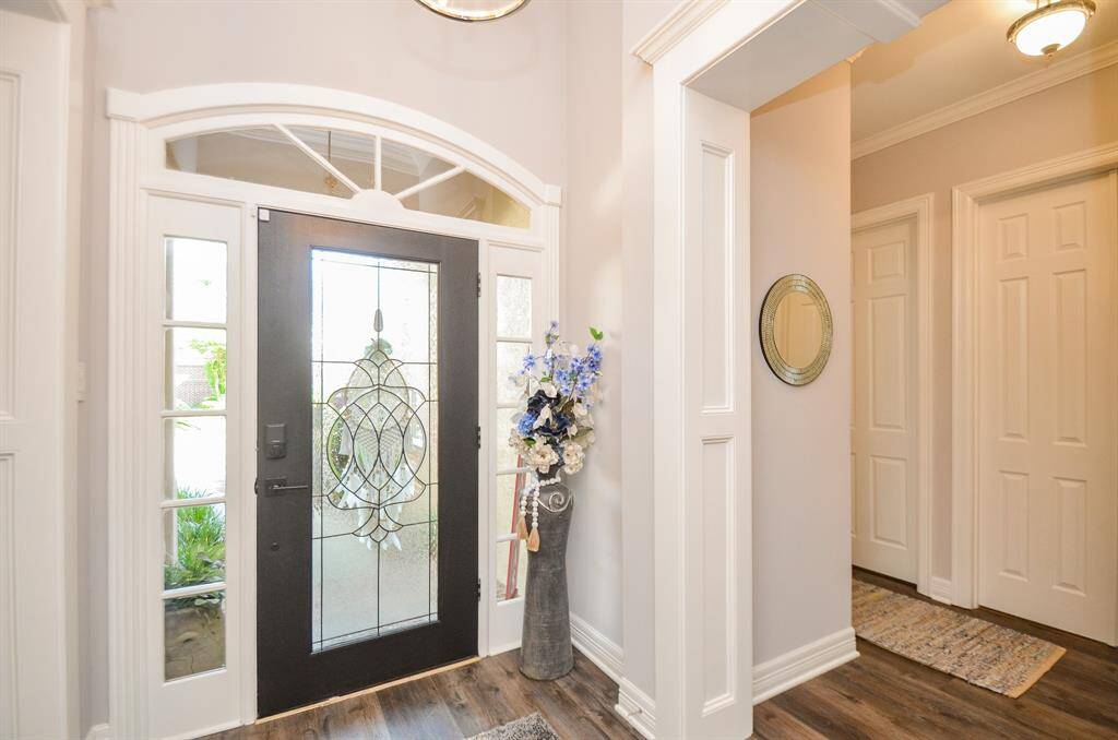 Welcoming entrance to your new home. To the left is the garage, laundry room, bedroom, and bathroom.