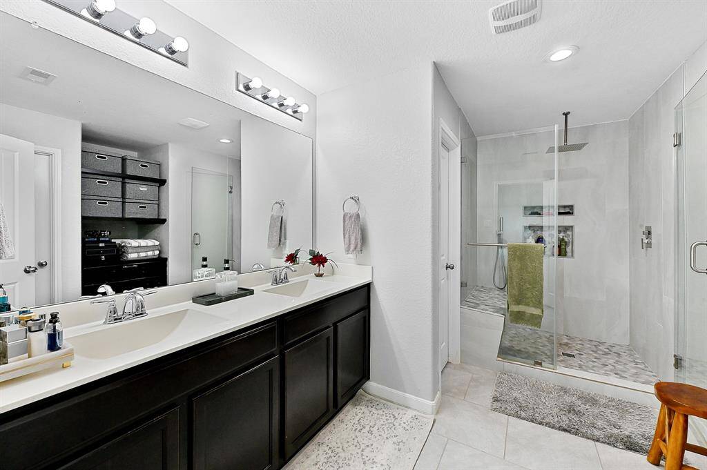 Primary shower with built-in bench.