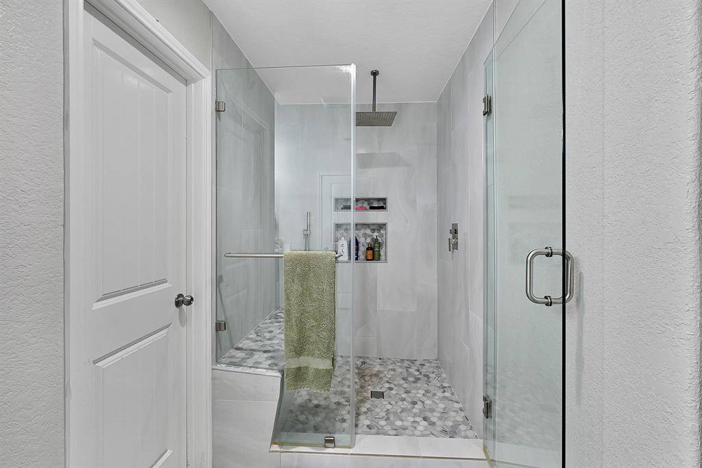 Tempered glass shower door.