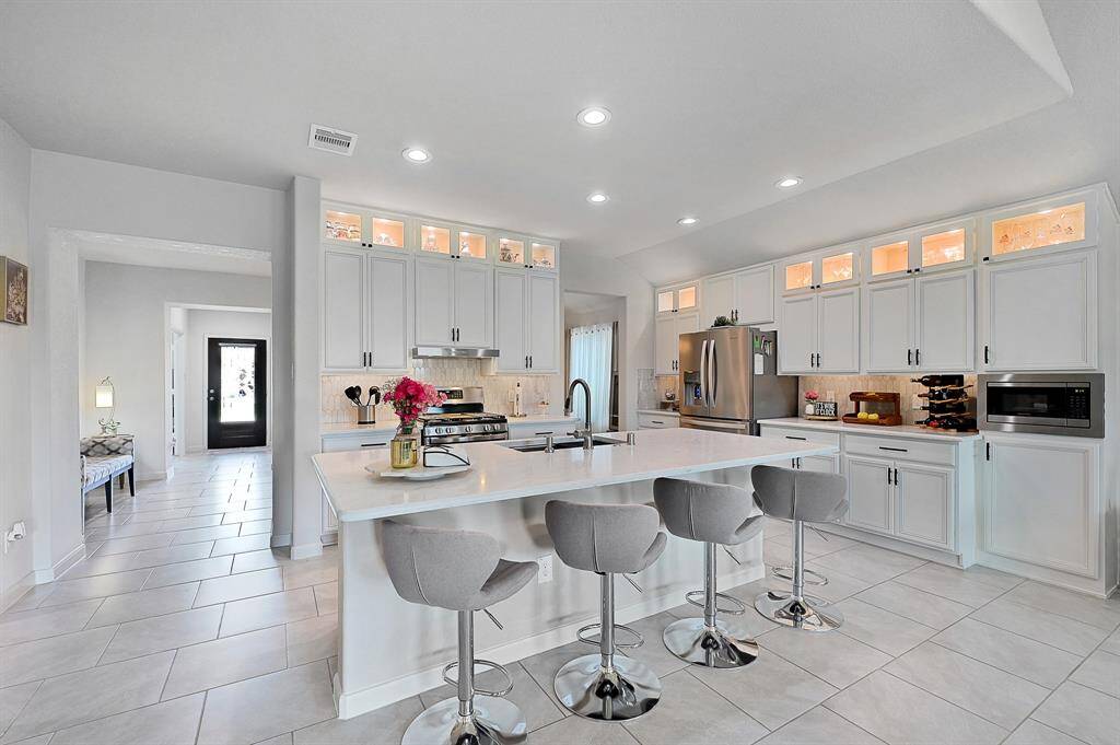 Kitchen has been taken to the next level with In-Cabinet lighting and oversized Island.