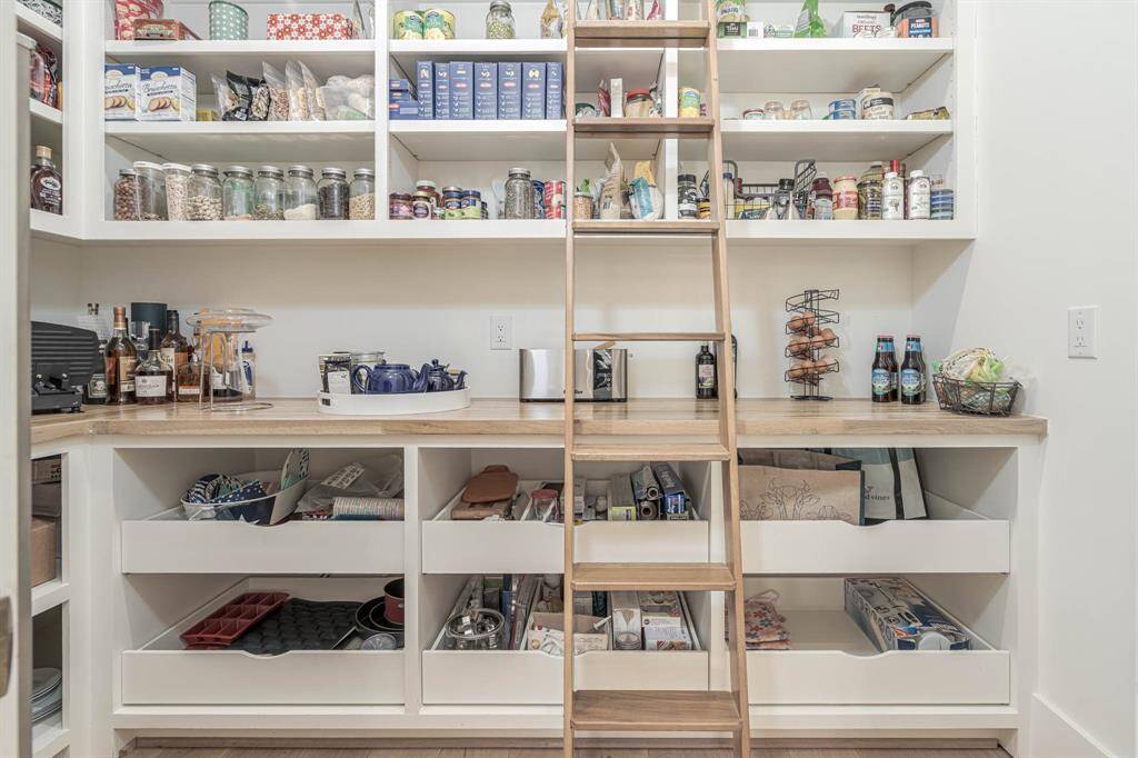 THE DREAM PANTRY! well-organized with ample shelving and storage. With Elkay water fountain