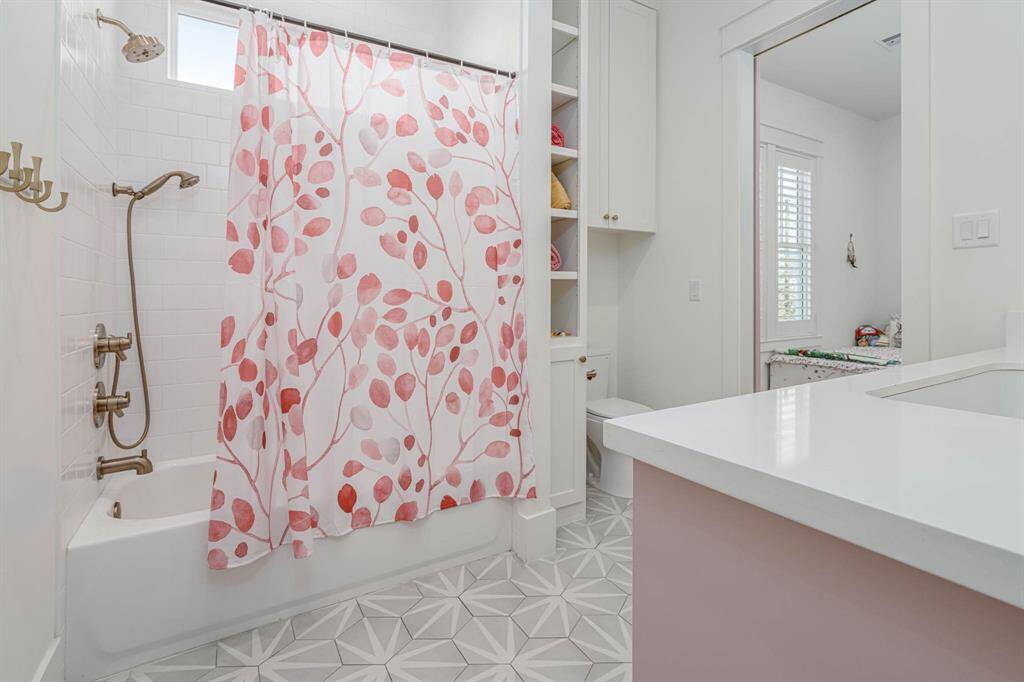 Secondary upstairs bathroom features a bright, clean design