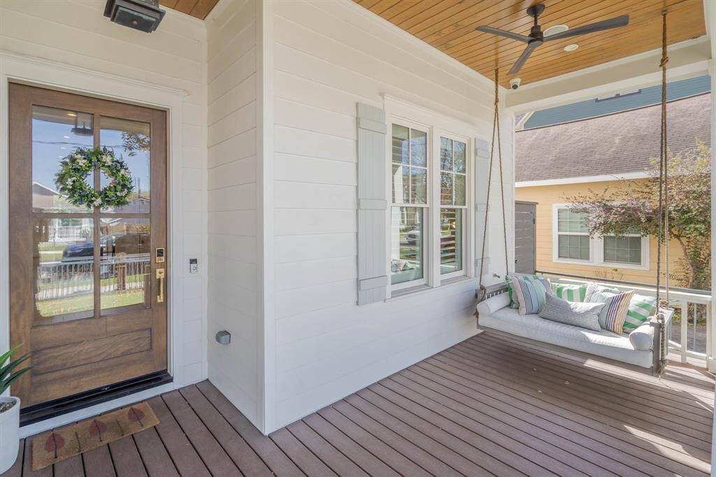 Charming front porch with a cozy swing perfect for relaxing outdoors.