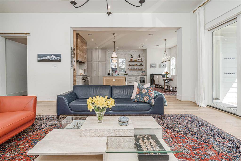 Large windows let in ample natural light, enhancing the airy feel.