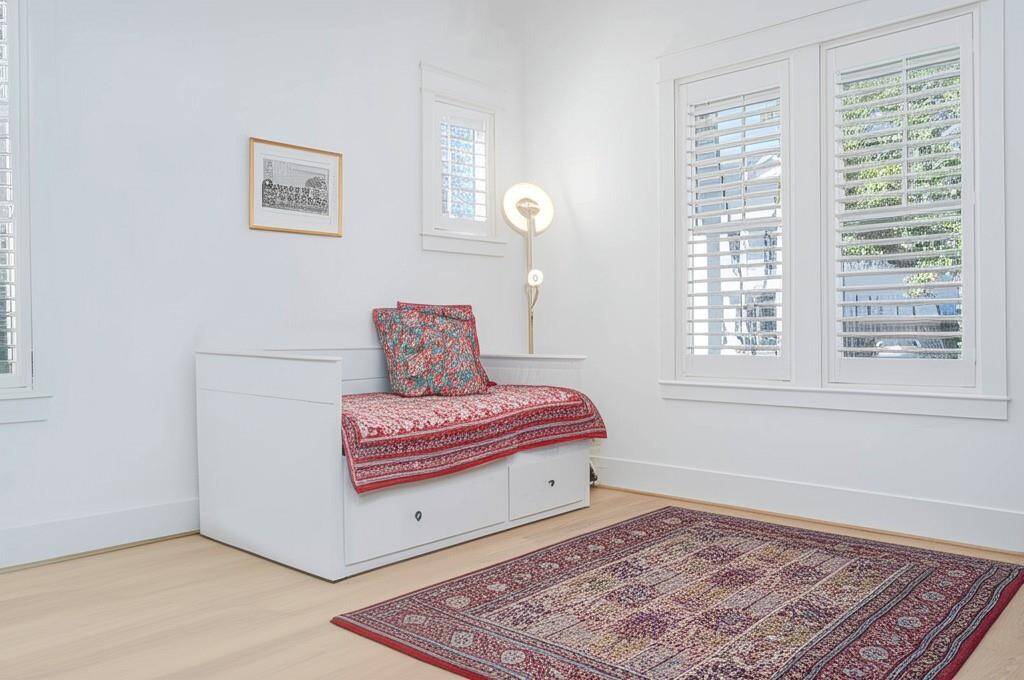 Inviting first-floor office with abundant natural light, plantation shutters and stylish accents.