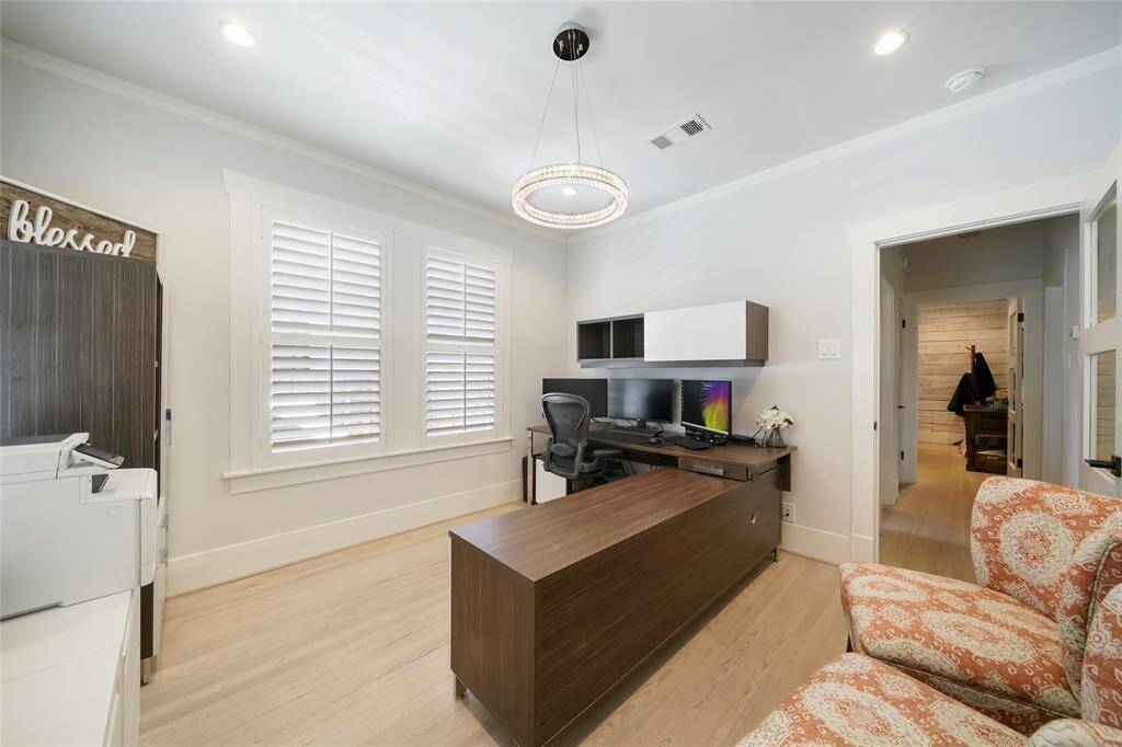 Secondary bedroom used as an office. This bedroom faces the backyard