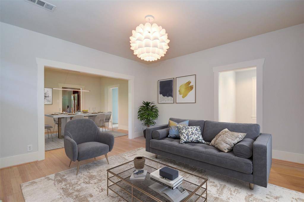 Inviting living room connects to the dining room and one of the bedrooms/ office space