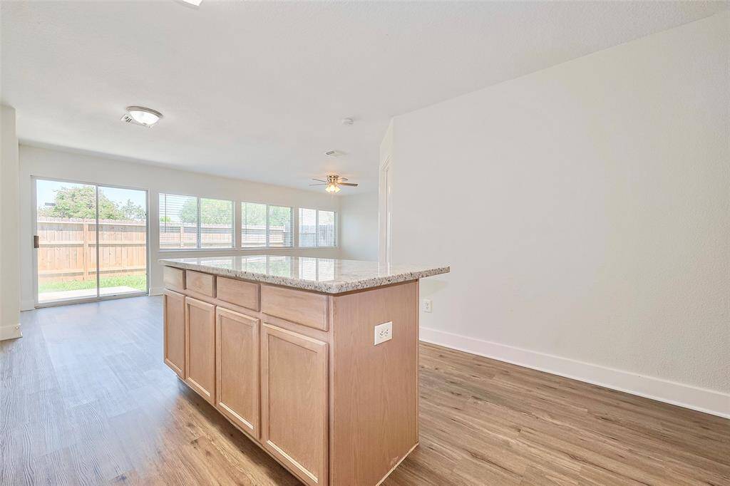 The island offers additional storage, counter top space