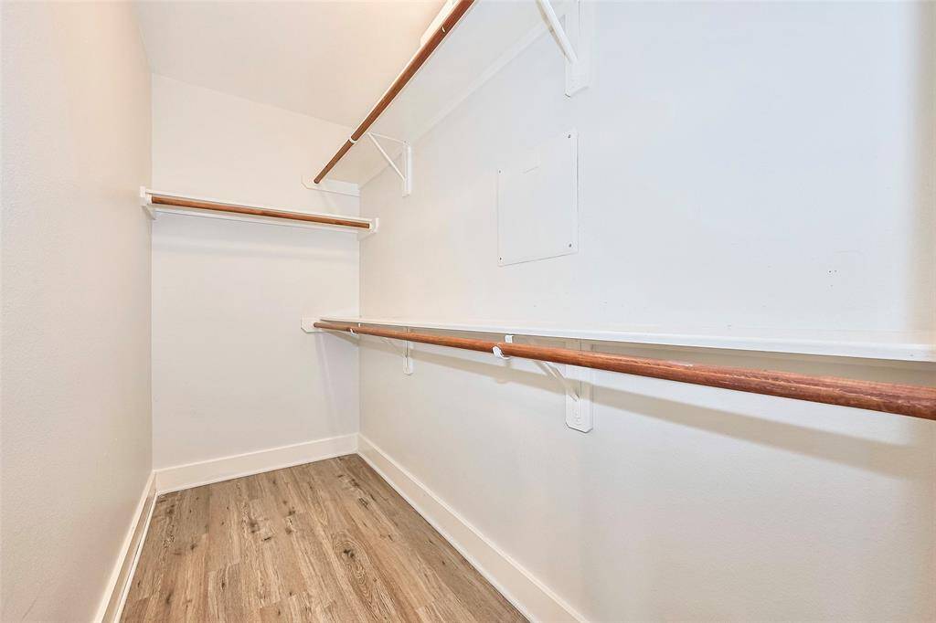 The walk in closet in the primary bedroom