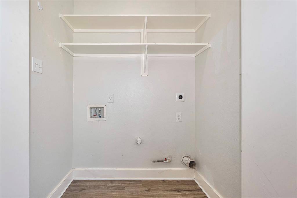 The utility room features connections for washer and dryer