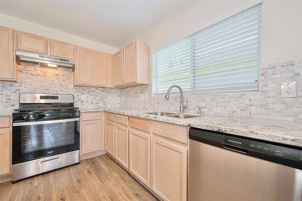 A view of the kitchen feature granite countertop