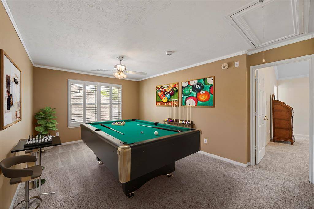 Virtually staged game room.