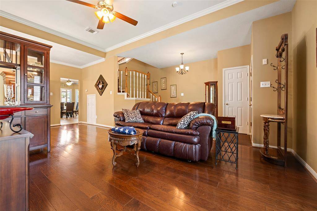 This beauty has lots of crown molding, plantation shutters, and tons of extras.