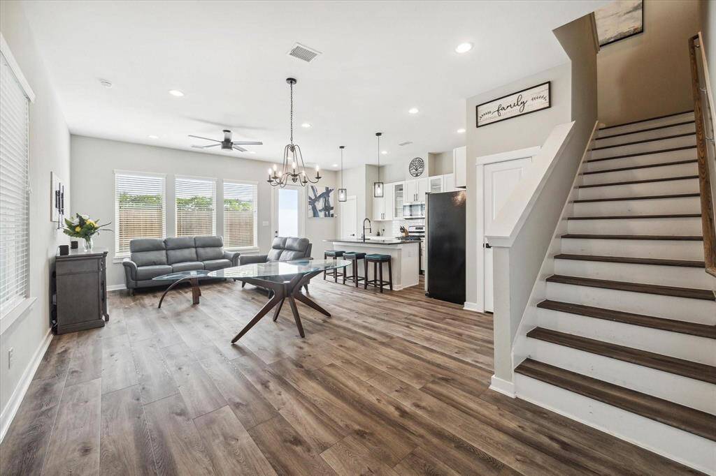 Entry first floor Living/Dining/Kitchen with stairs leading to the second floor level.