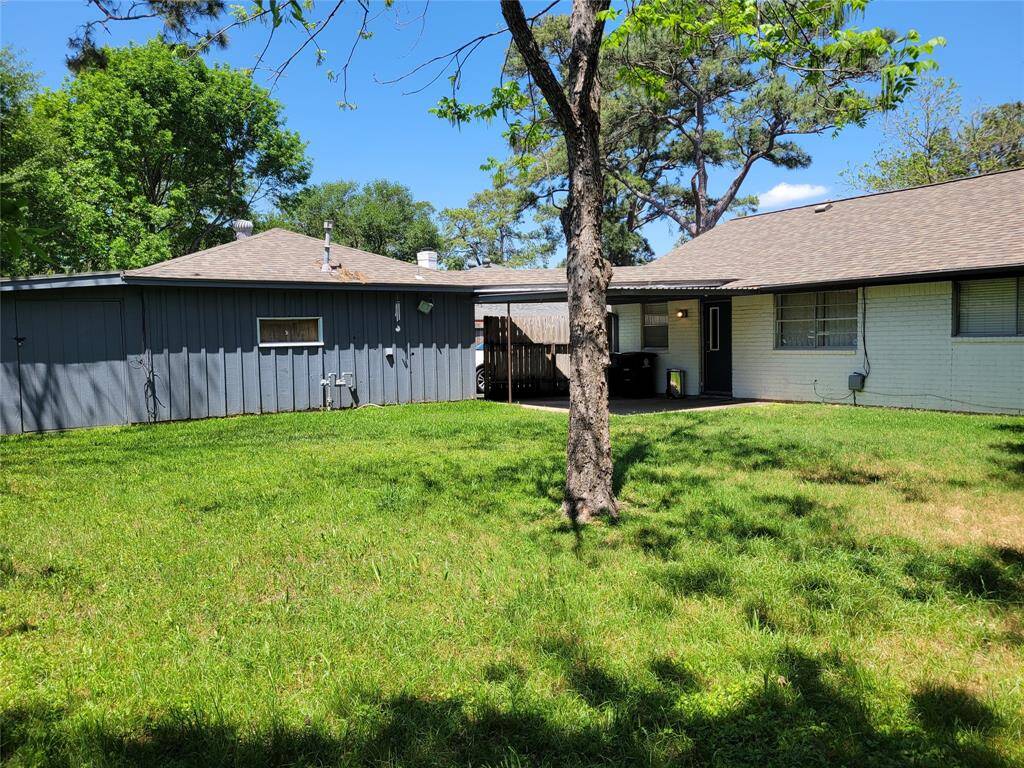 Large backyard with covered patio.