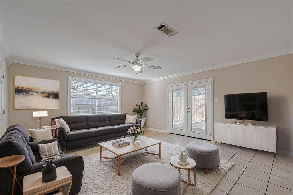 The living area includes French doors onto an oversized, backyard deck. *Virtually Staged*