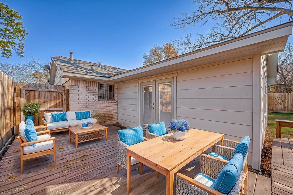 Spacious backyard with mature trees and oversized deck! *Virtually Staged*