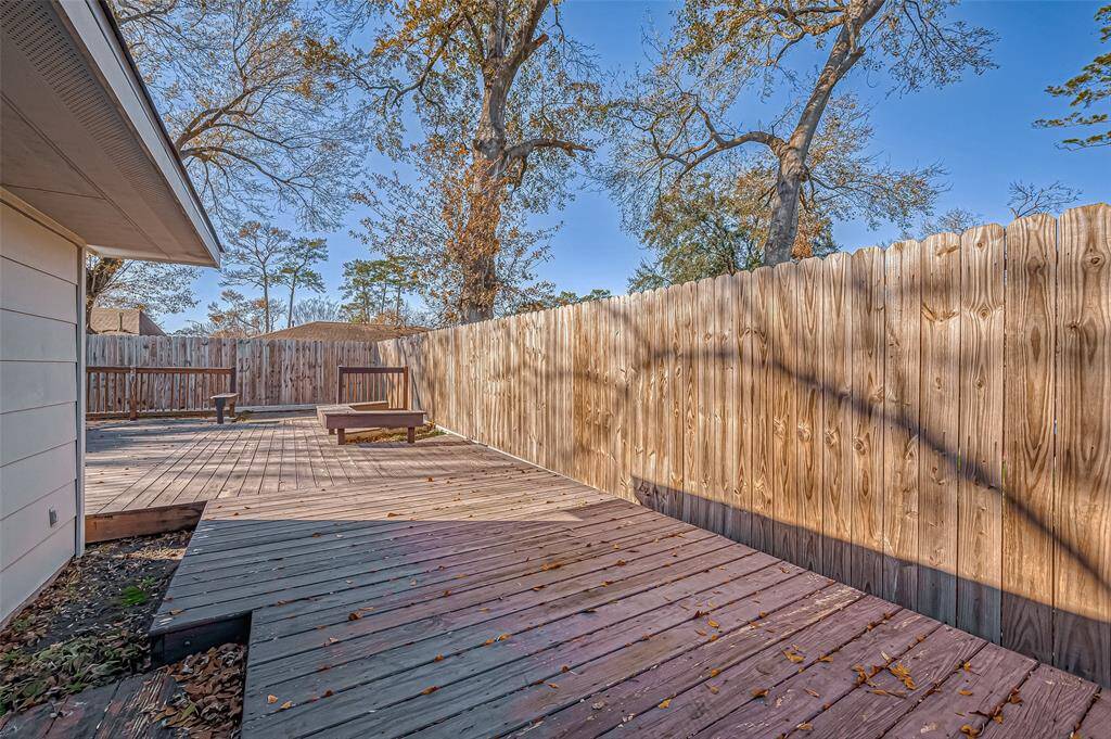 Spacious backyard with mature trees and oversized deck!