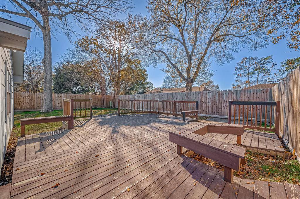 Spacious backyard with mature trees and oversized deck!