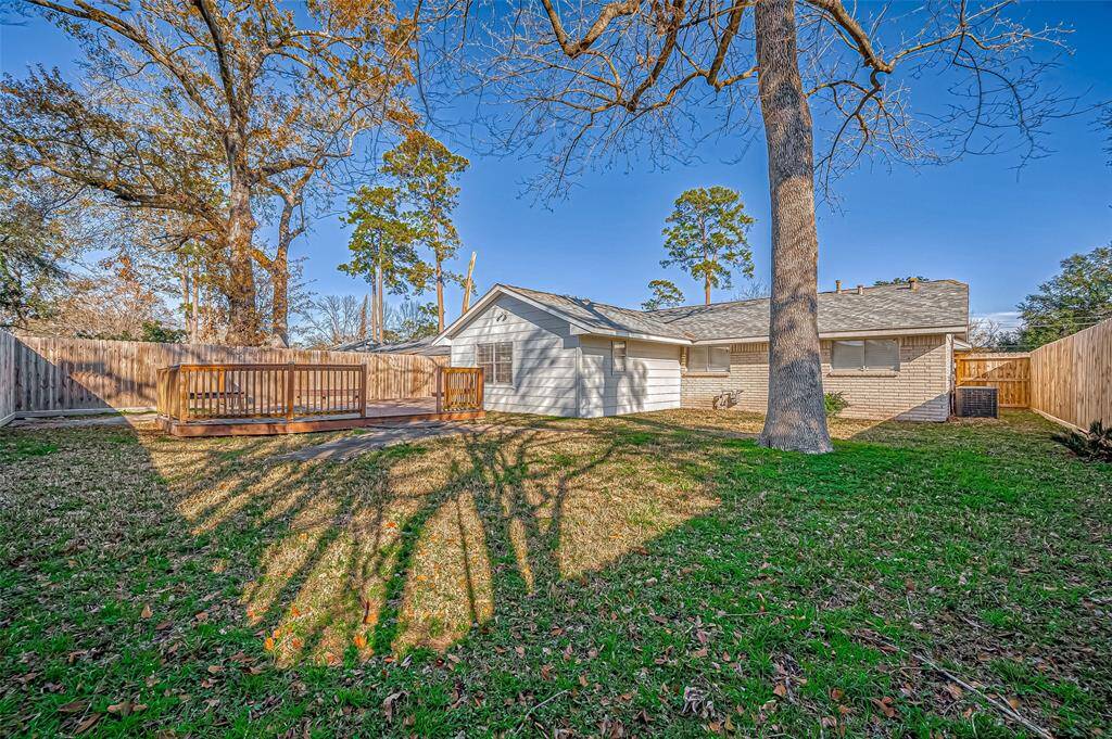 Spacious backyard with mature trees and oversized deck!