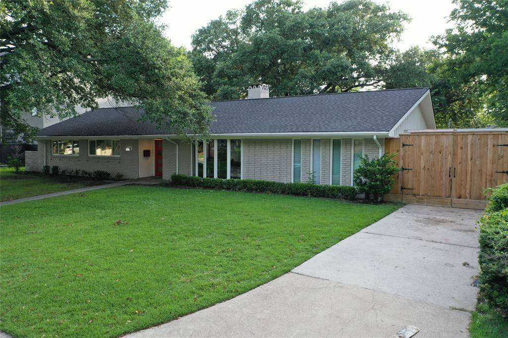 Secure gated driveway offering ample additional parking space.