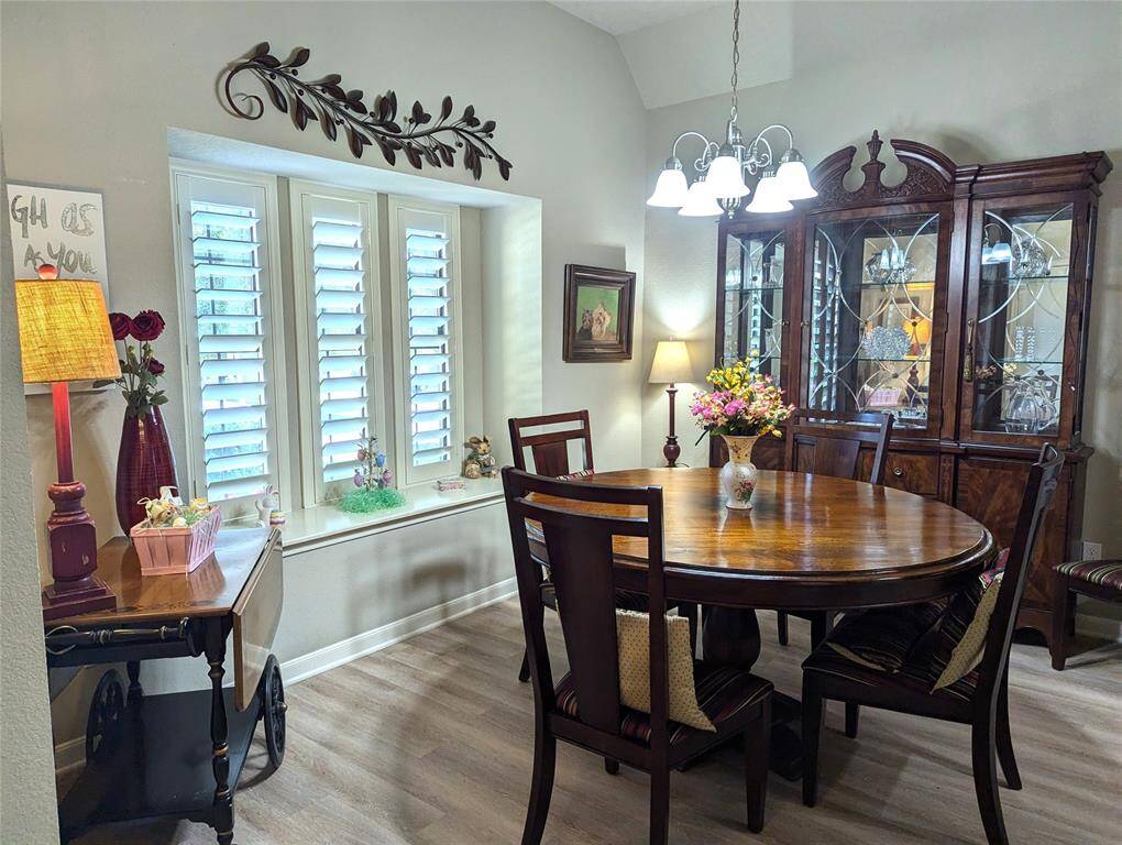 Stunning dining room! Plantation shutters here and throughout! Window seat.