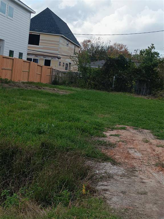 This lot is 50 ft wide and ready for your next project. New construction on both sides.