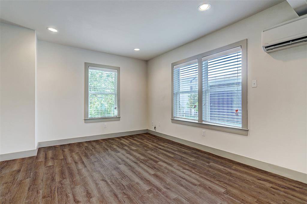 LARGEST Fourplex -Beautiful living area with windows on every wall....new blinds and ample natural light!