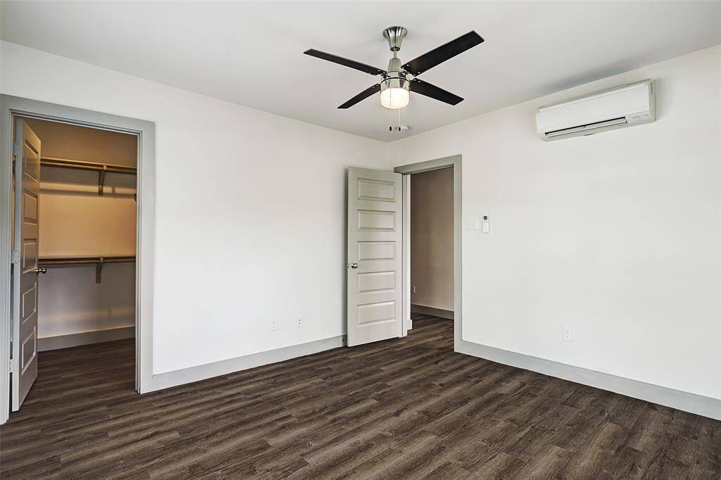 LARGEST Fourplex -Large bedroom with ample natural light, a ceiling fan and walk in closet!