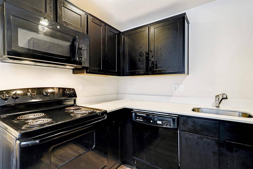 SMALLER FOURPLEX -Nice Kitchen with updated appliances and tons of cabinet space!