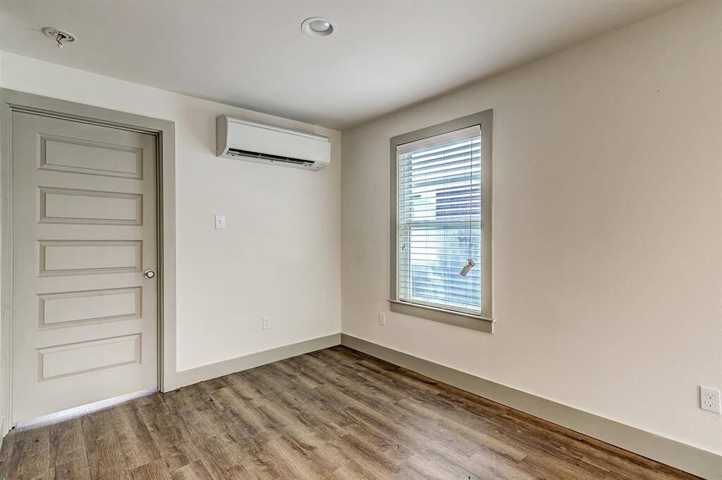 SMALLER FOURPLEX - Corner of living...the door you see is the bedroom door.