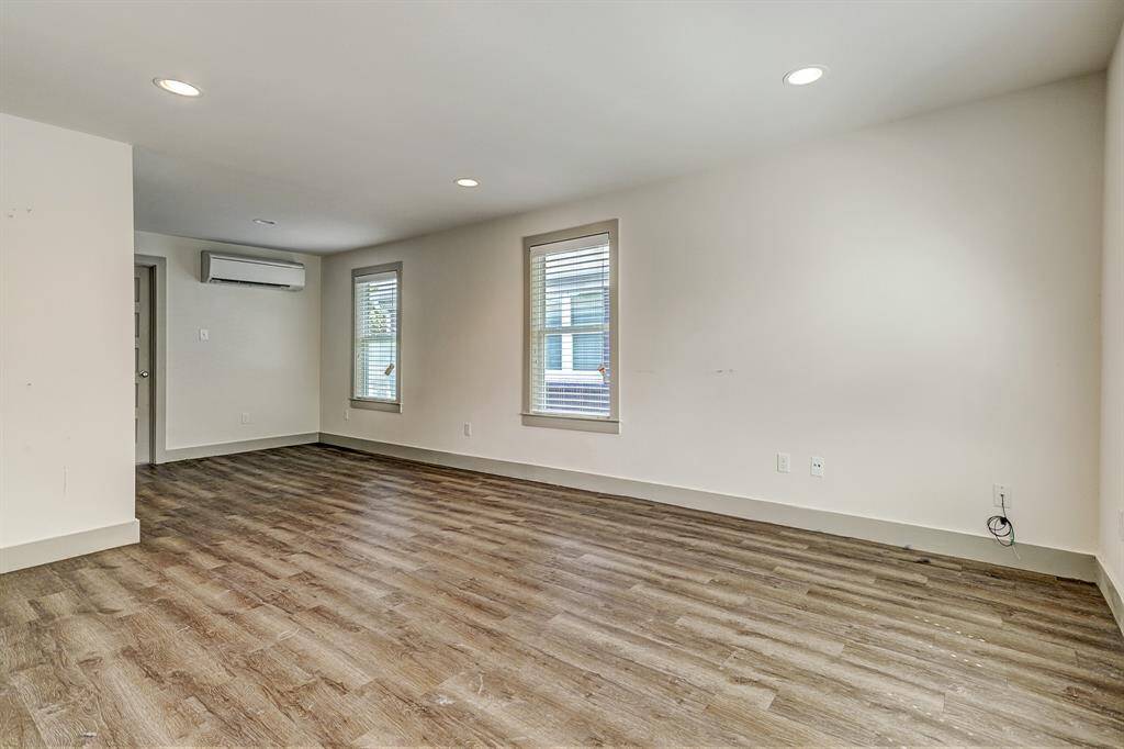 SMALLER FOURPLEX -Corner of living...the door you see is the bedroom door.
