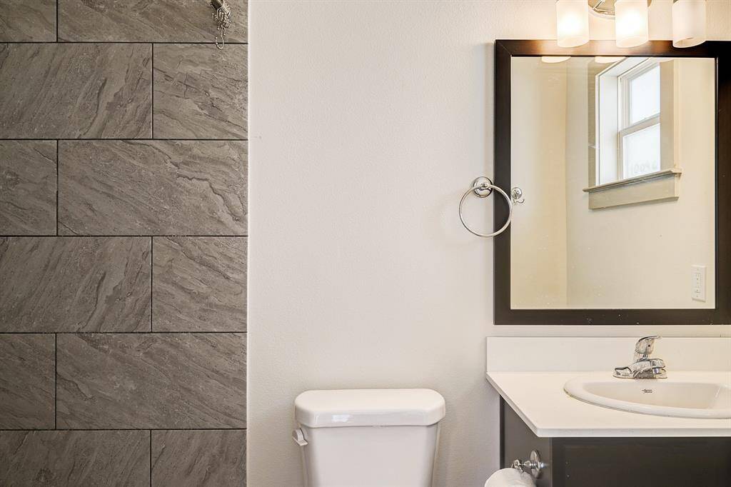 SMALLER FOURPLEX -Beautifully updated bathroom with modern fixtures..