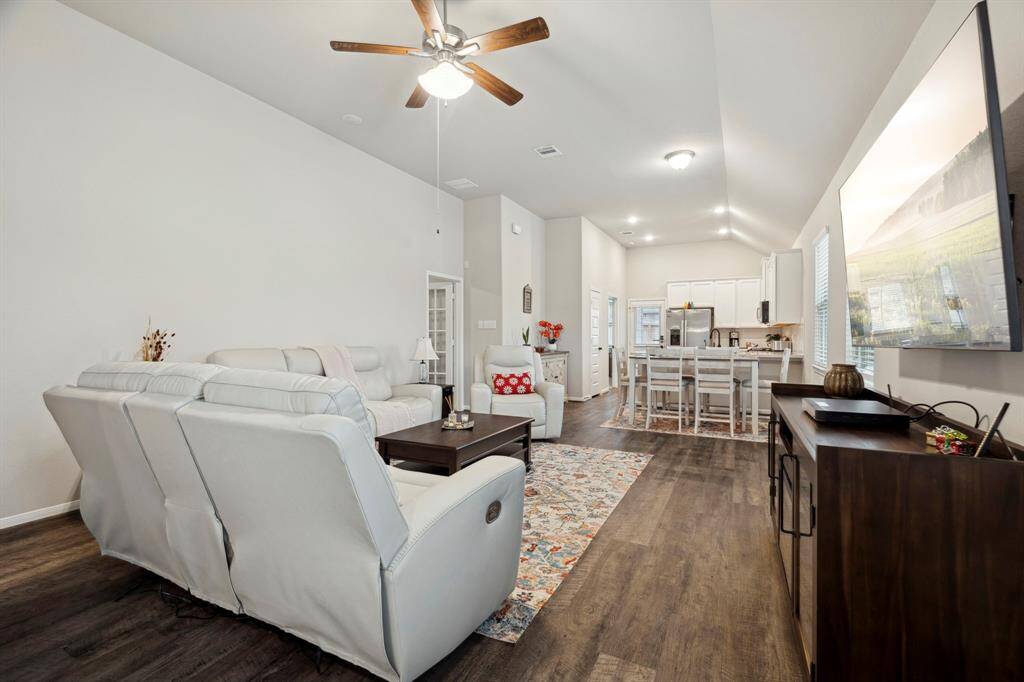 Step into your cozy abode through the elegant main entryway, offering ample space and a warm, inviting atmosphere.