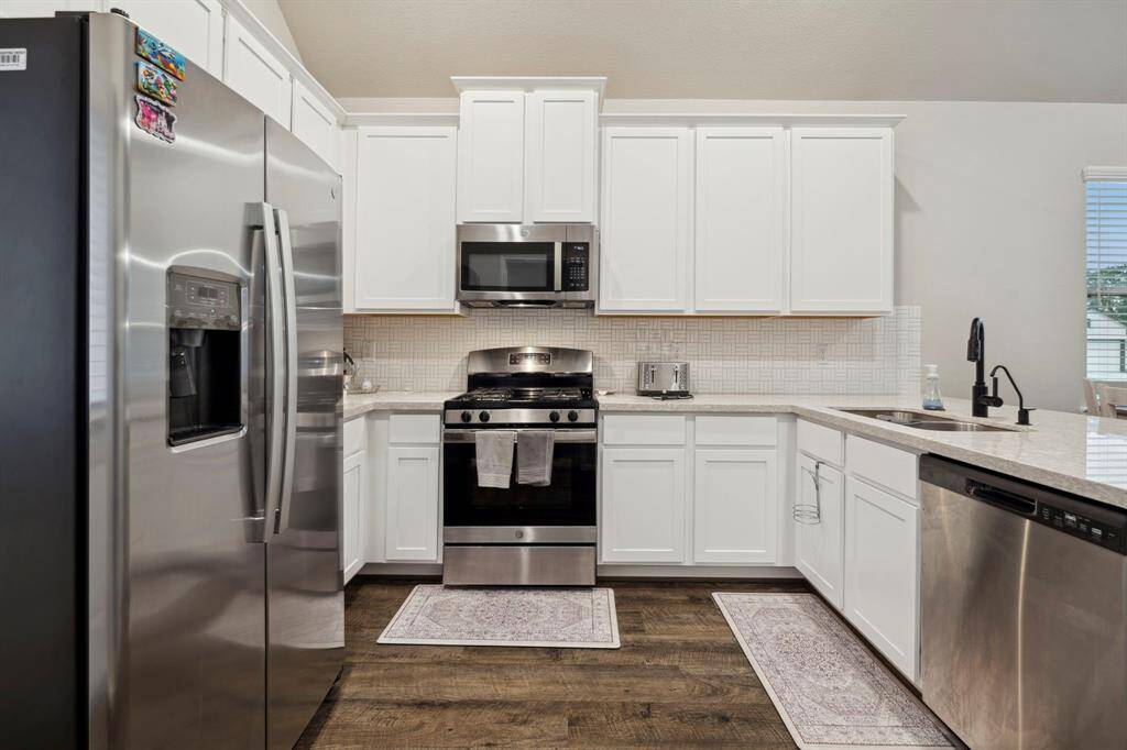 The heart of the home is the open-concept kitchen and living area, designed to be the hub of daily life and entertaining.