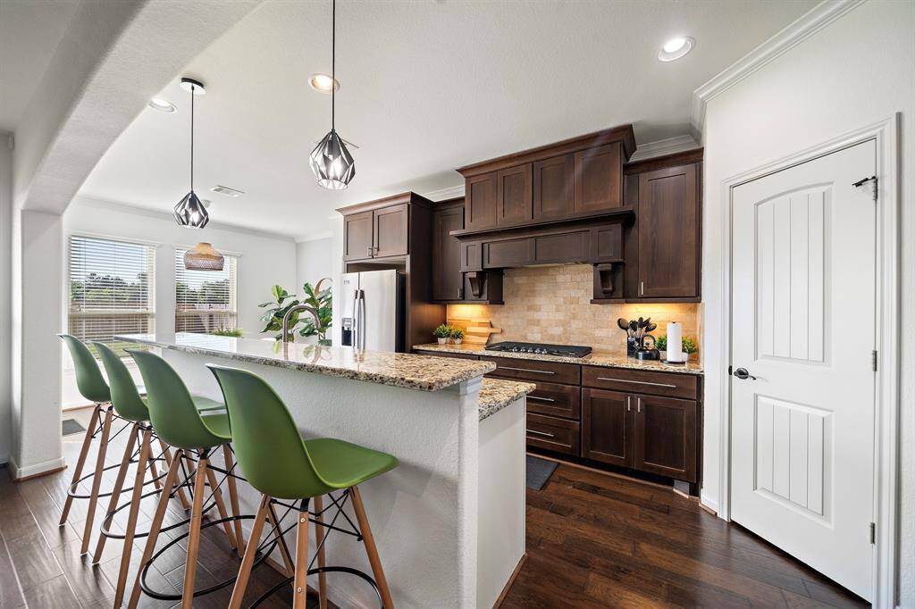 Beautiful wood cabinetry and breakfast bar.