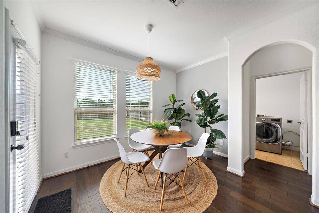 Spacious breakfast room looks out over private backyard.