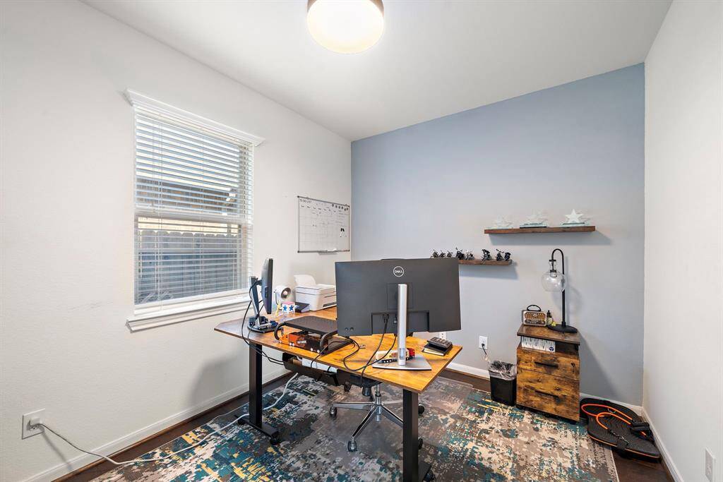 2nd bedroom DOWNSTAIRS, tucked away behind the kitchen with a split floorplan.