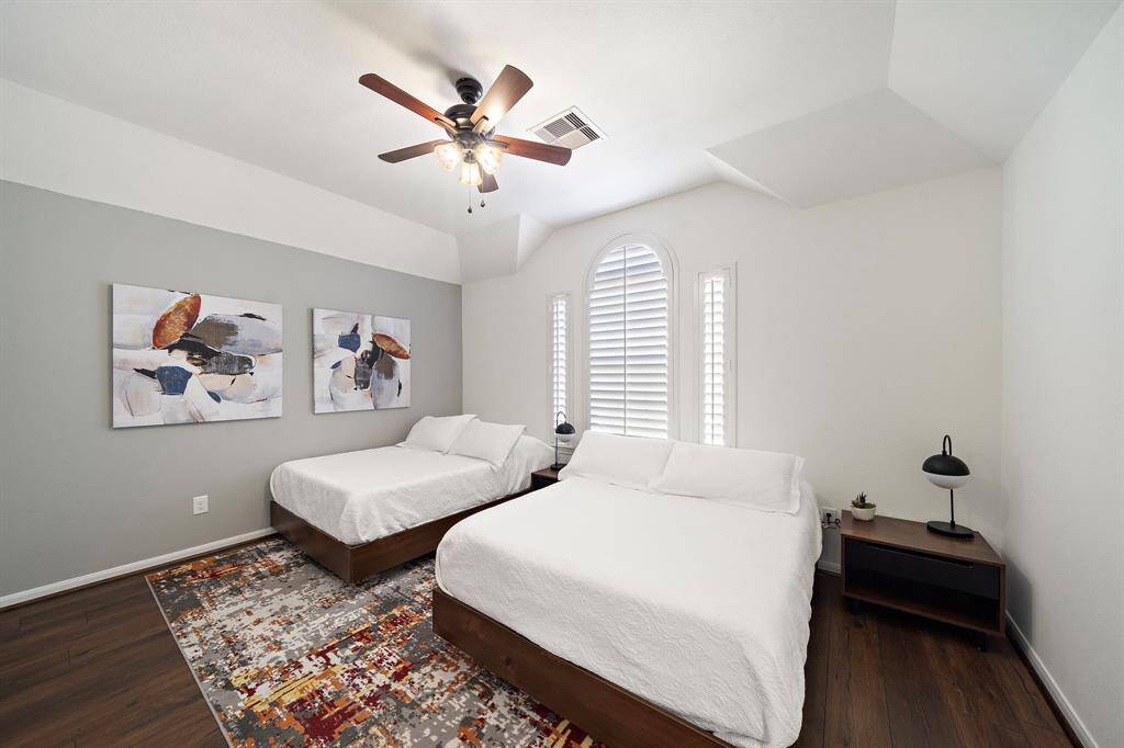 Bedroom 4 upstairs features hardwood floors, large closet, ceiling fan, plantation shutters and shares a jack & jill bathroom.