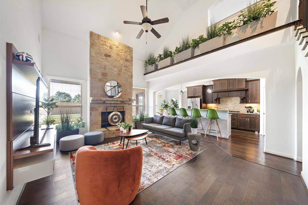 Soaring 20 foot high ceilings provide a warm and welcome living area.