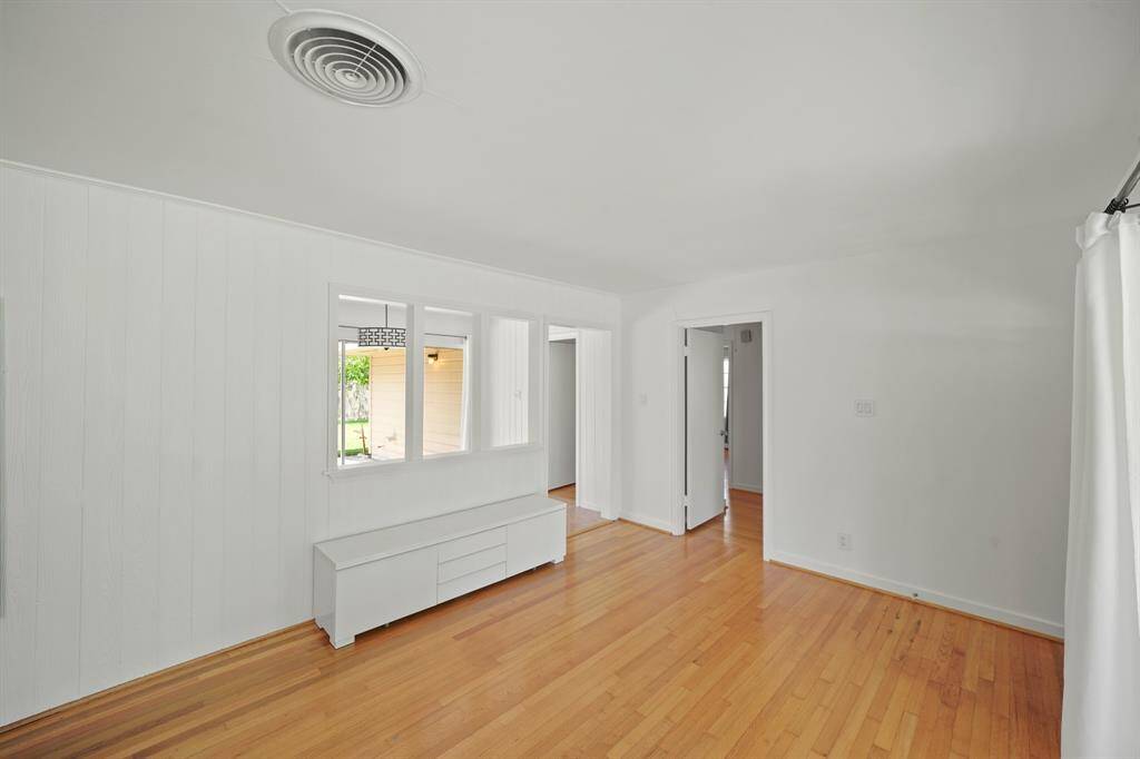 A View from the Dining Area looking to the Foyer and to the Living Area.