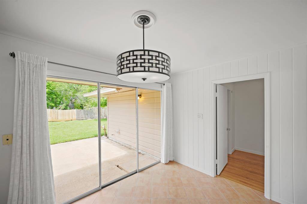 The Breakfast Room boasts a Triple Sliding Glass Door that opens to the Expansive Concrete Patio and to the Park-Like Backyard.  White Linen Style Fabric Tab Drapes and Fresh White Designer Paint are also offered in the Breakfast Room.