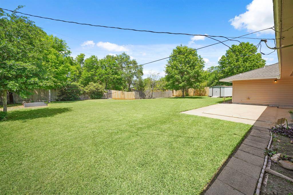 Enjoy the Tranquility of this Park-Like Yard (Property is + 1/3 Acre).  Invite Friends and Family to enjoy Backyard Games and a Cook-out!