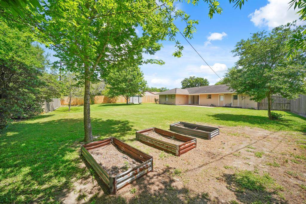 The Backyard features Landscaped Garden Beds plus 3 Raised Garden Beds---Perfect for Flowers or Summer Vegetables!