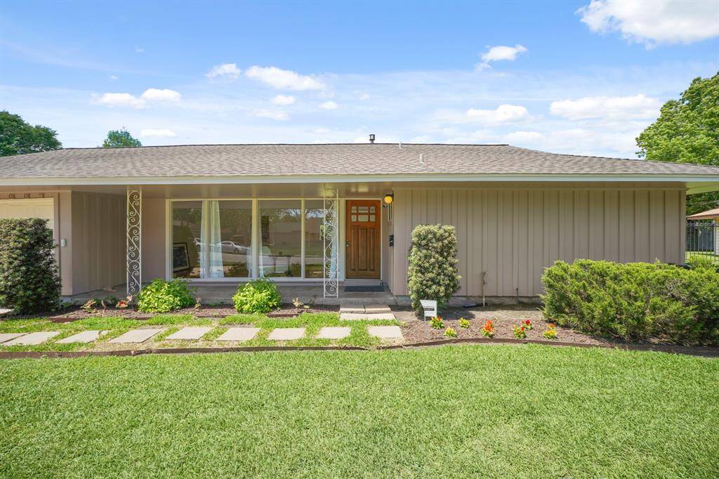 The Curb Appeal of the Home is enhanced by Landscaped Garden Beds that frame the Front Entrance. Enjoy Morning Coffee on the Elongated Front Porch (Approximately 21'11" x 4'6"). The Front Porch features Ornamental Metal Columns.