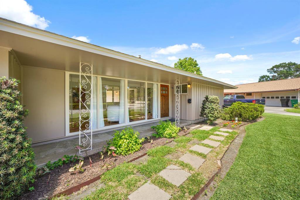 Your Guests are greeted by an Attractive Concrete Paver Walkway located from the Driveway to the Front Porch.