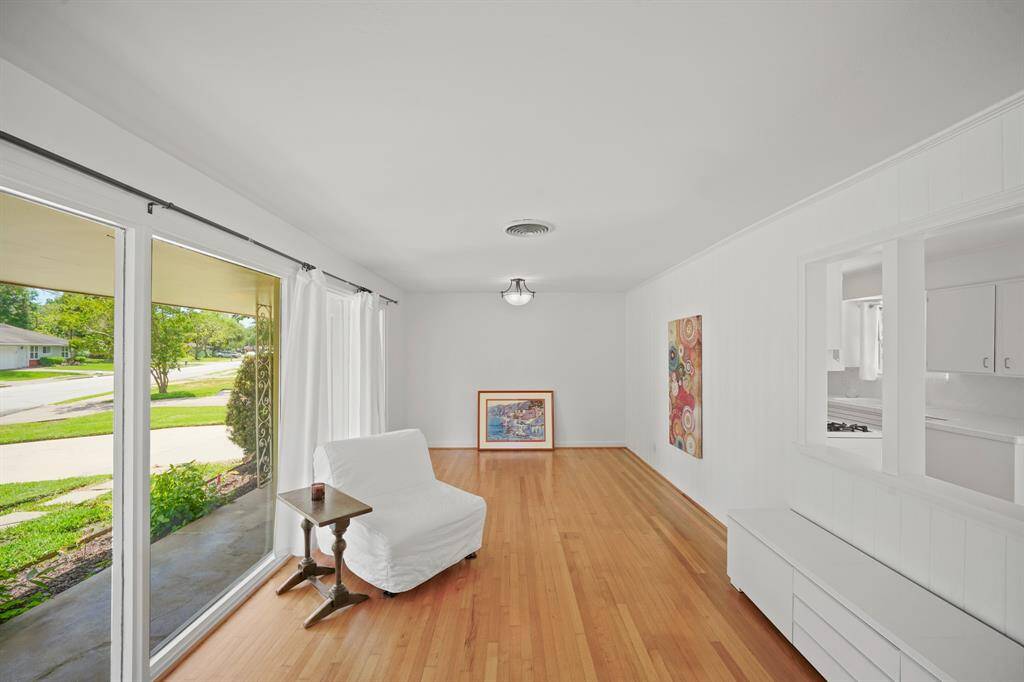 The Living Area boasts a Floor to Ceiling Picture Window (6'6" x 3'8") that views the Landscaped Front Yard.