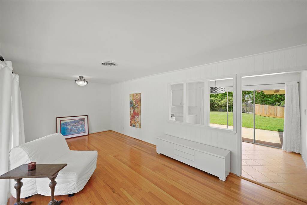 The Living Area opens to the Kitchen and to the Breakfast Room Area and offers Fresh White Designer Paint.